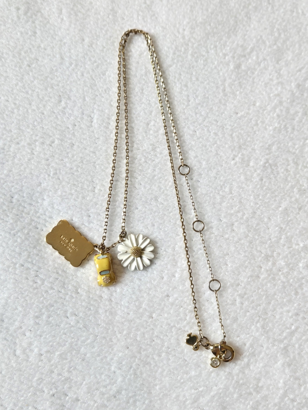 kate spade New York Off We Go Gold Necklace with White Daisy & Taxi Car Charms